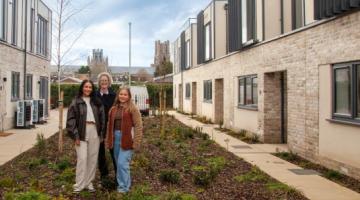 Lauren Martin, Jasmine Sparrow and Cllr Anna Bailey standing outside of Eden Square homes in Ely